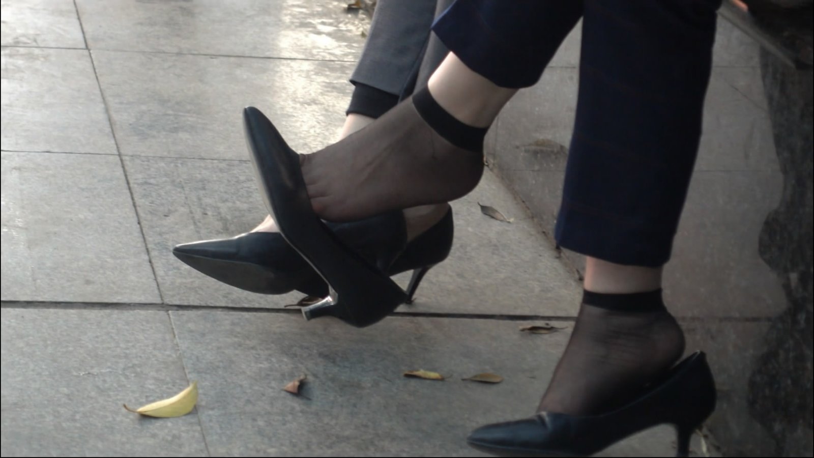 Short brown hair, feet dangling